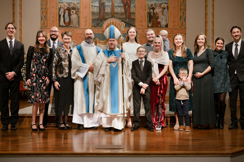 Group photo of my family, Bishop Spalding, and me.